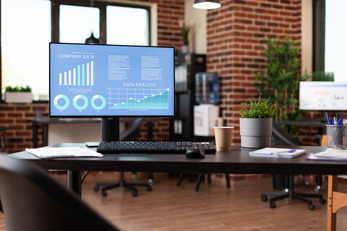 Close up of computer with company data analysis on display